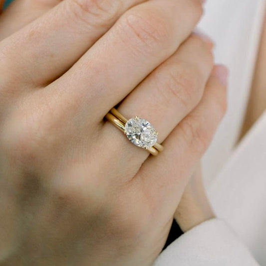East-West Oval Moissanite Solitaire with Hidden Halo
